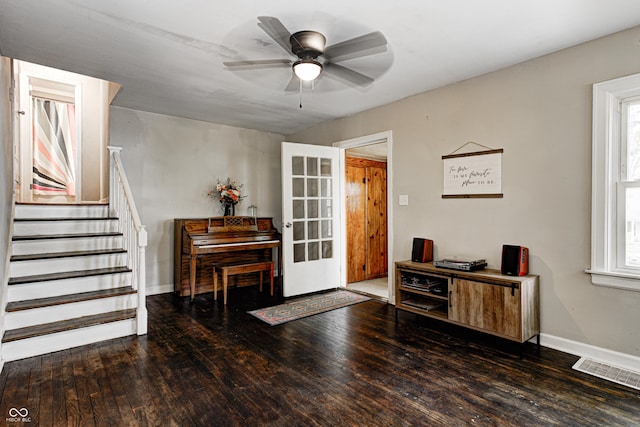 entrance foyer featuring ceiling fan, a healthy amount of sunlight, visible vents, and wood finished floors