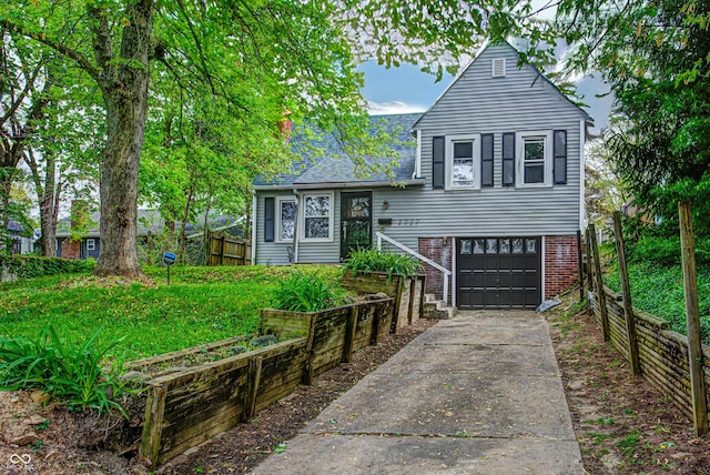 split level home with concrete driveway, brick siding, fence, and an attached garage