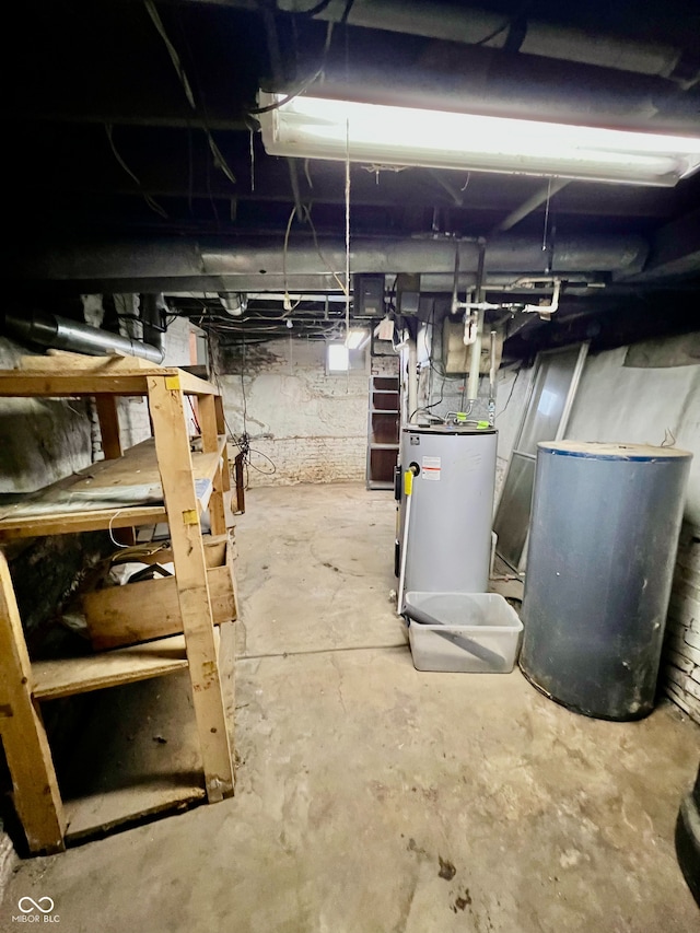 unfinished basement featuring water heater