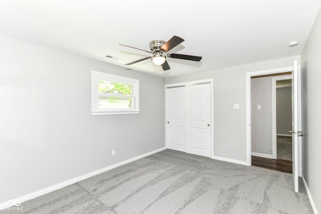 7118 Mikesell Dr, Indianapolis, IN 46260 - unfurnished bedroom featuring carpet flooring, baseboards, a closet, and a ceiling fan