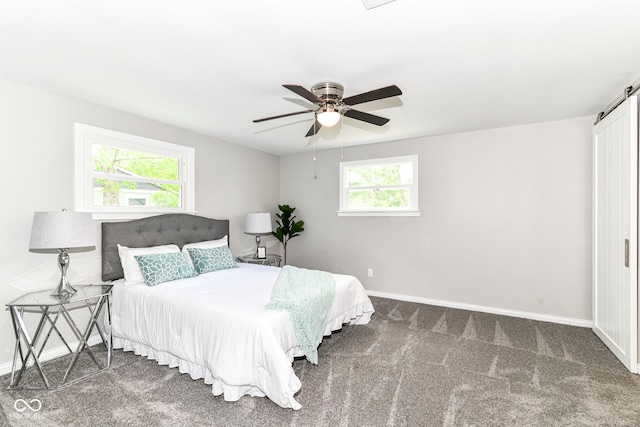 7118 Mikesell Dr, Indianapolis, IN 46260 - carpeted bedroom featuring multiple windows, baseboards, and ceiling fan