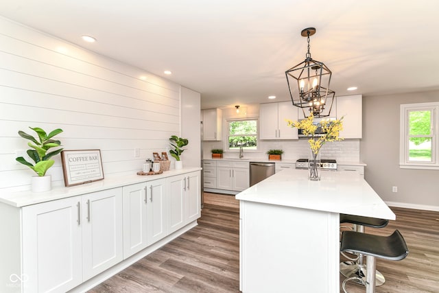 7118 Mikesell Dr, Indianapolis, IN 46260 - kitchen with dishwasher, a sink, light wood-type flooring, plenty of natural light, and recessed lighting
