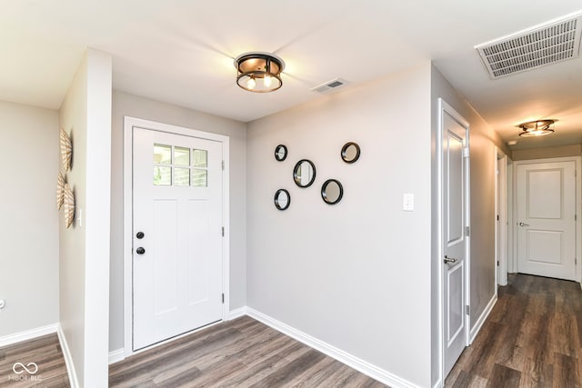 7118 Mikesell Dr, Indianapolis, IN 46260 - entrance foyer with dark wood-style floors and baseboards