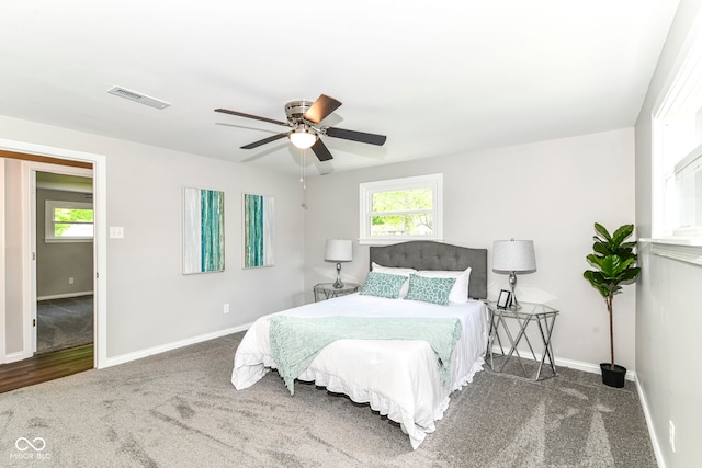 7118 Mikesell Dr, Indianapolis, IN 46260 - bedroom with carpet floors, baseboards, and a ceiling fan