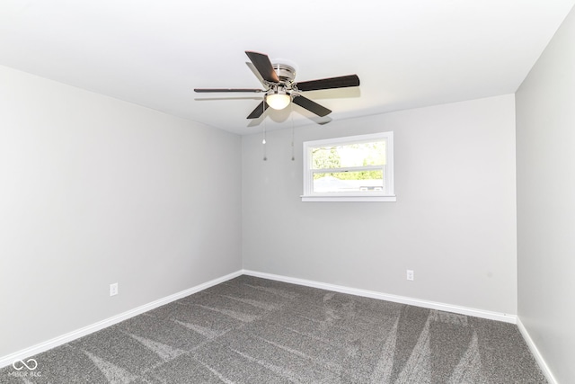 7118 Mikesell Dr, Indianapolis, IN 46260 - spare room with dark colored carpet, ceiling fan, and baseboards