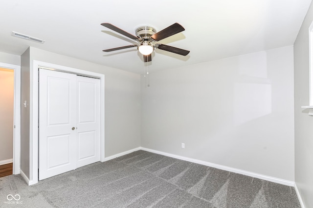 7118 Mikesell Dr, Indianapolis, IN 46260 - unfurnished bedroom featuring carpet, baseboards, a closet, and a ceiling fan