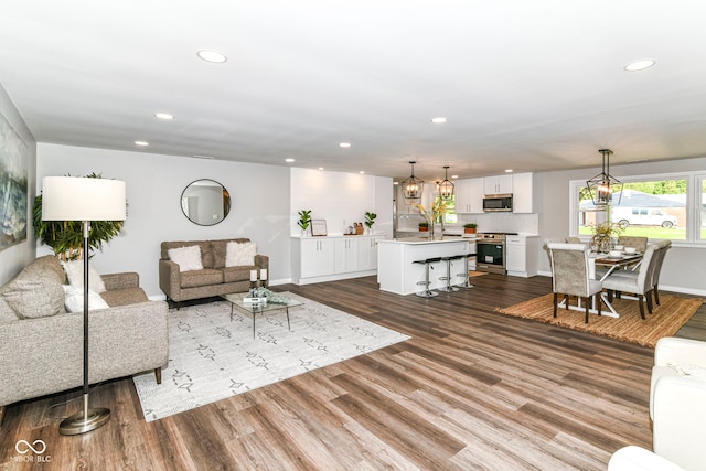 7118 Mikesell Dr, Indianapolis, IN 46260 - living area featuring recessed lighting, dark wood-type flooring, and baseboards