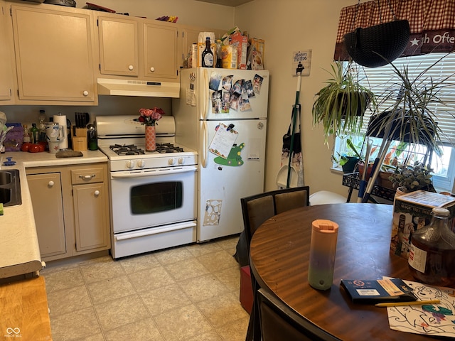 400-416 S Pennsylvania St, Greenfield, IN 46140 - kitchen featuring white appliances, under cabinet range hood, light countertops, and light flooring