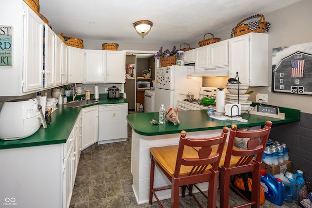 400-416 S Pennsylvania St, Greenfield, IN 46140 - kitchen featuring white appliances, a sink, under cabinet range hood, white cabinets, and washer / clothes dryer