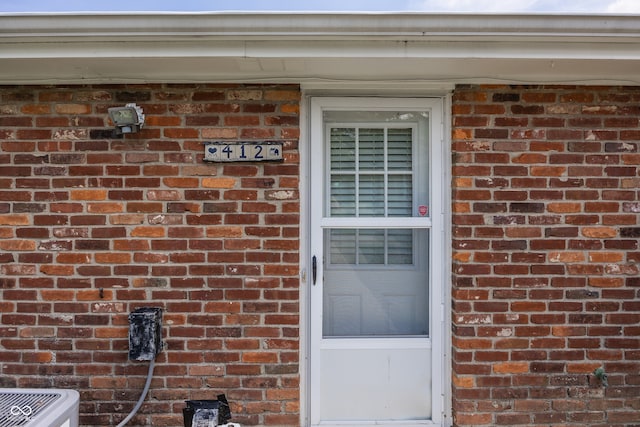 400-416 S Pennsylvania St, Greenfield, IN 46140 - property entrance featuring brick siding and central AC unit
