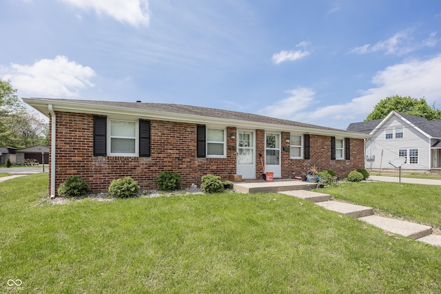 400-416 S Pennsylvania St, Greenfield, IN 46140 - view of front of house featuring brick siding and a front yard