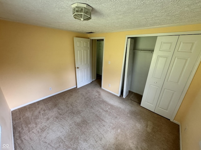 575 Mill Spgs, Coatesville, IN 46121 - unfurnished bedroom featuring carpet flooring, a textured ceiling, a closet, and baseboards