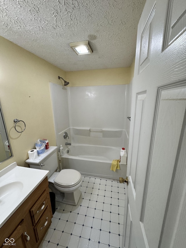 575 Mill Spgs, Coatesville, IN 46121 - bathroom featuring tile patterned floors, vanity, bathing tub / shower combination, toilet, and a textured ceiling