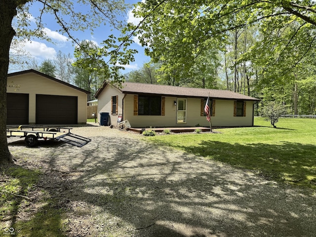 575 Mill Spgs, Coatesville, IN 46121 - ranch-style house with a detached garage, an outdoor structure, and a front yard