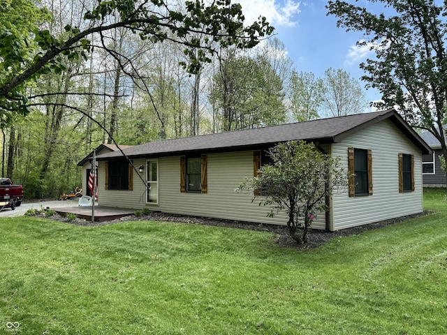 575 Mill Spgs, Coatesville, IN 46121 - view of front of house with a front yard and roof with shingles