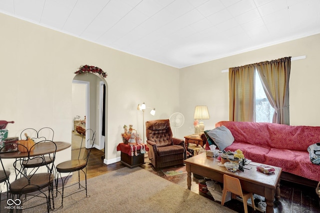 205 E Washington St, Roachdale, IN 46172 - living room with crown molding, arched walkways, and wood finished floors