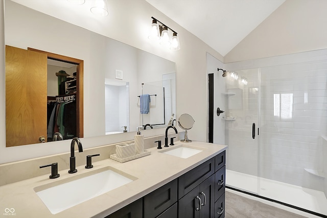 11471 Clarkston Rd, Zionsville, IN 46077 - full bathroom with a stall shower, vaulted ceiling, double vanity, and a walk in closet