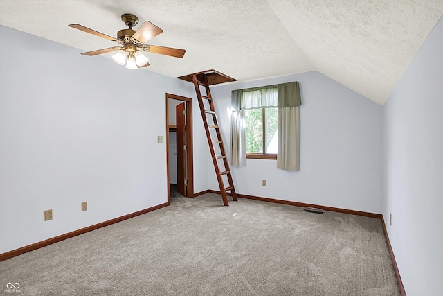 11471 Clarkston Rd, Zionsville, IN 46077 - bonus room featuring carpet flooring, a ceiling fan, baseboards, a textured ceiling, and lofted ceiling