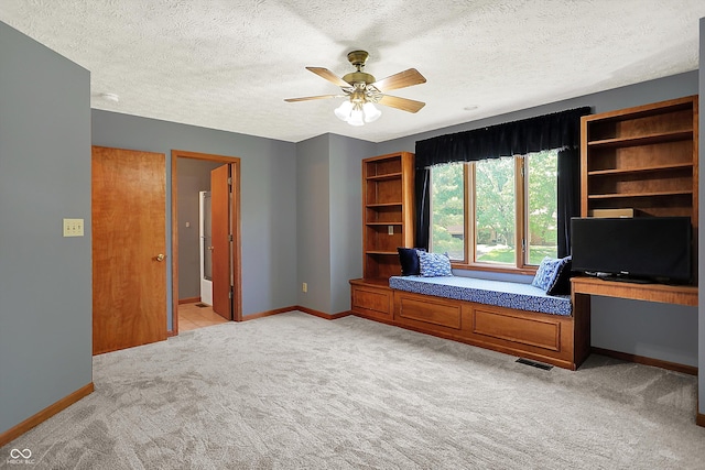 11471 Clarkston Rd, Zionsville, IN 46077 - unfurnished bedroom featuring light carpet, baseboards, a textured ceiling, and ceiling fan