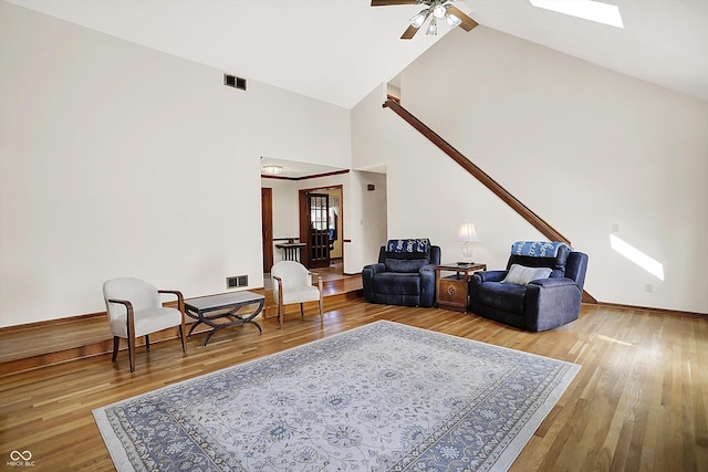 11471 Clarkston Rd, Zionsville, IN 46077 - living room featuring high vaulted ceiling, wood finished floors, a ceiling fan, and baseboards