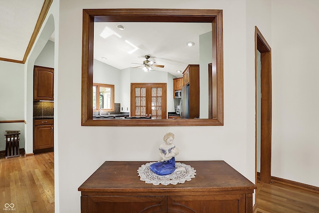 11471 Clarkston Rd, Zionsville, IN 46077 - corridor featuring light wood-style flooring, vaulted ceiling, baseboards, and recessed lighting