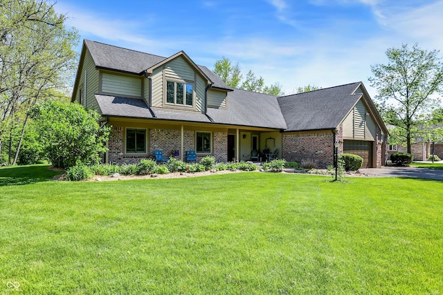 11471 Clarkston Rd, Zionsville, IN 46077 - view of front of home with brick siding, a front lawn, driveway, and an attached garage