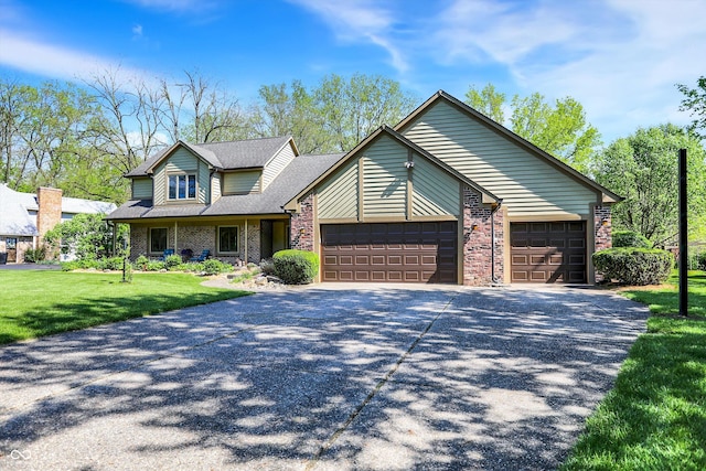 11471 Clarkston Rd, Zionsville, IN 46077 - view of front of property featuring a garage, brick siding, concrete driveway, and a front yard