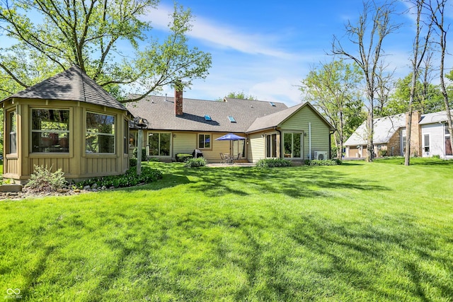 11471 Clarkston Rd, Zionsville, IN 46077 - back of property featuring a chimney, a gazebo, a lawn, and board and batten siding