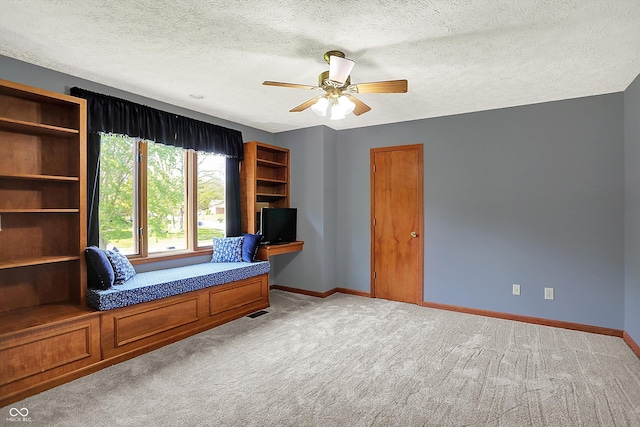 11471 Clarkston Rd, Zionsville, IN 46077 - living area featuring light colored carpet, ceiling fan, baseboards, and a textured ceiling