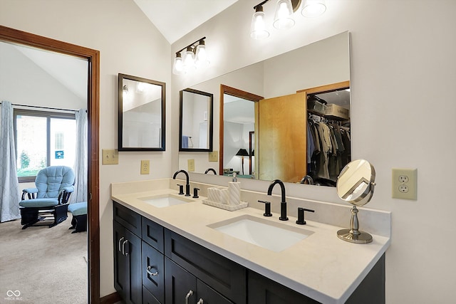 11471 Clarkston Rd, Zionsville, IN 46077 - full bathroom featuring vaulted ceiling, double vanity, and connected bathroom