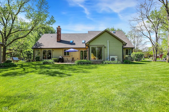 11471 Clarkston Rd, Zionsville, IN 46077 - back of property featuring a chimney, a yard, a shingled roof, and a patio area