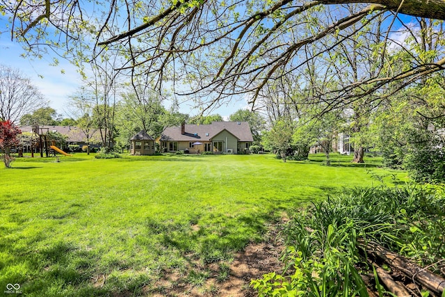 11471 Clarkston Rd, Zionsville, IN 46077 - view of grassy yard with a playground