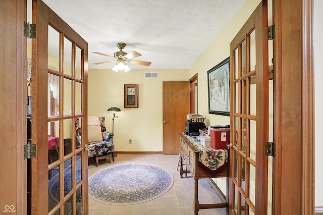 11471 Clarkston Rd, Zionsville, IN 46077 - foyer featuring french doors, ceiling fan, light tile patterned floors, and baseboards