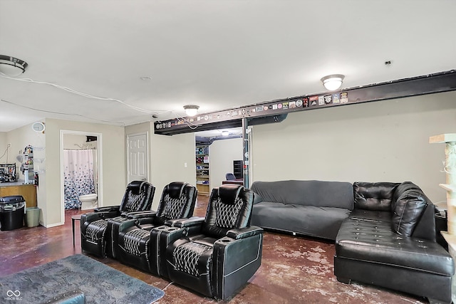 home theater featuring concrete flooring