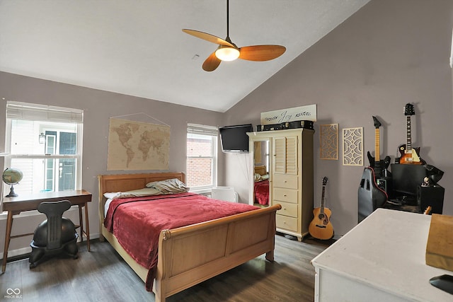 bedroom featuring wood finished floors, vaulted ceiling, an office area, and a ceiling fan