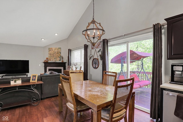 dining space featuring a chandelier, dark wood finished floors, high vaulted ceiling, recessed lighting, and a tiled fireplace