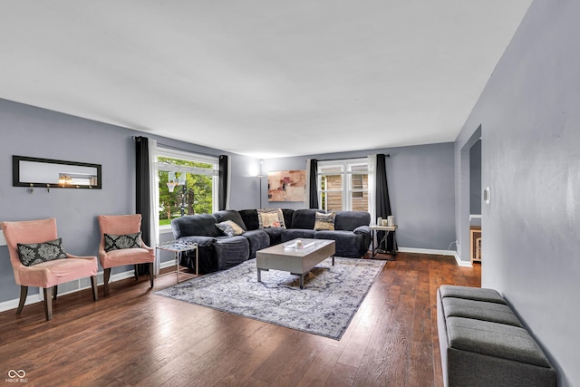 living area featuring hardwood / wood-style floors and baseboards