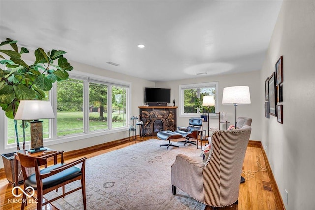 6465 Lawrence Dr, Indianapolis, IN 46226 - living room with baseboards, wood finished floors, a fireplace, and recessed lighting