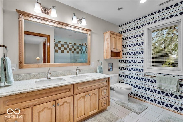 6465 Lawrence Dr, Indianapolis, IN 46226 - full bath with a stall shower, toilet, double vanity, and tile patterned floors