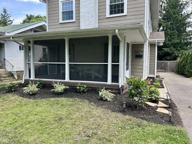5829 Broadway St, Indianapolis, IN 46220 - view of side of property with a sunroom