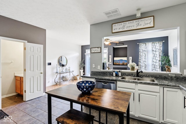 7045 Gavin Dr, Indianapolis, IN 46217 - kitchen with a sink, dishwasher, dark countertops, and ceiling fan