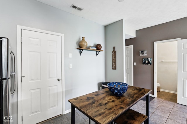 7045 Gavin Dr, Indianapolis, IN 46217 - tiled foyer entrance with baseboards