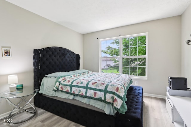 7045 Gavin Dr, Indianapolis, IN 46217 - bedroom with wood finished floors and baseboards