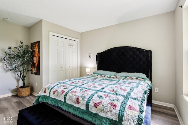 7045 Gavin Dr, Indianapolis, IN 46217 - bedroom featuring wood finished floors, baseboards, and a closet