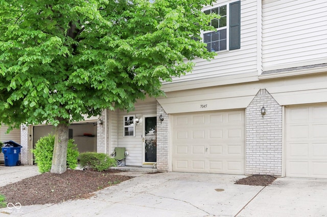 7045 Gavin Dr, Indianapolis, IN 46217 - garage featuring driveway