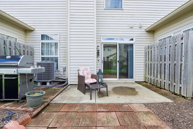 7045 Gavin Dr, Indianapolis, IN 46217 - view of patio / terrace with central AC unit, fence, and a grill