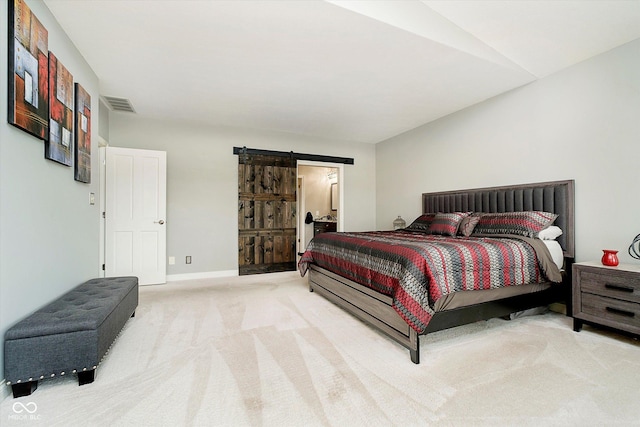 11319 Shoreview Ln, Indianapolis, IN 46236 - bedroom with a barn door, carpet flooring, baseboards, and connected bathroom