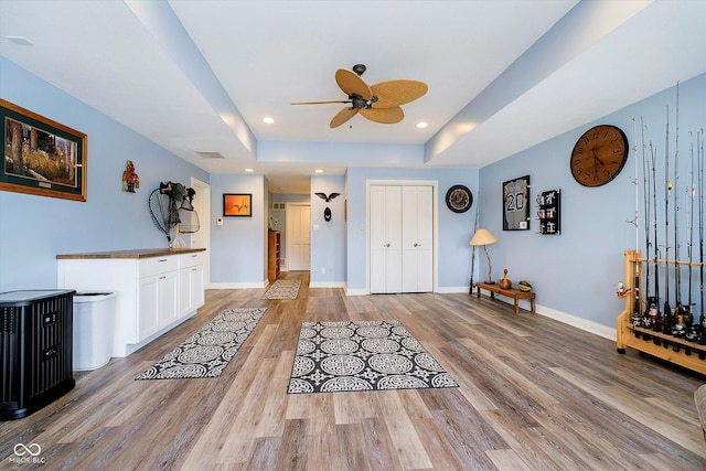 11319 Shoreview Ln, Indianapolis, IN 46236 - foyer featuring a ceiling fan, a raised ceiling, light wood-style flooring, baseboards, and recessed lighting