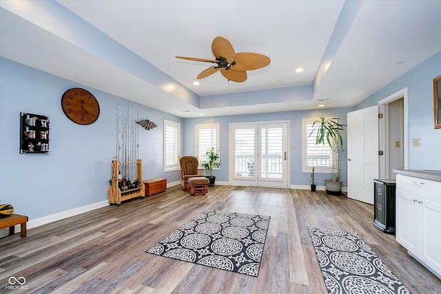 11319 Shoreview Ln, Indianapolis, IN 46236 - sitting room featuring a raised ceiling, ceiling fan, wood finished floors, baseboards, and recessed lighting