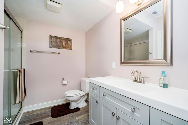 11319 Shoreview Ln, Indianapolis, IN 46236 - full bathroom featuring wood finished floors, a shower with door, vanity, toilet, and baseboards